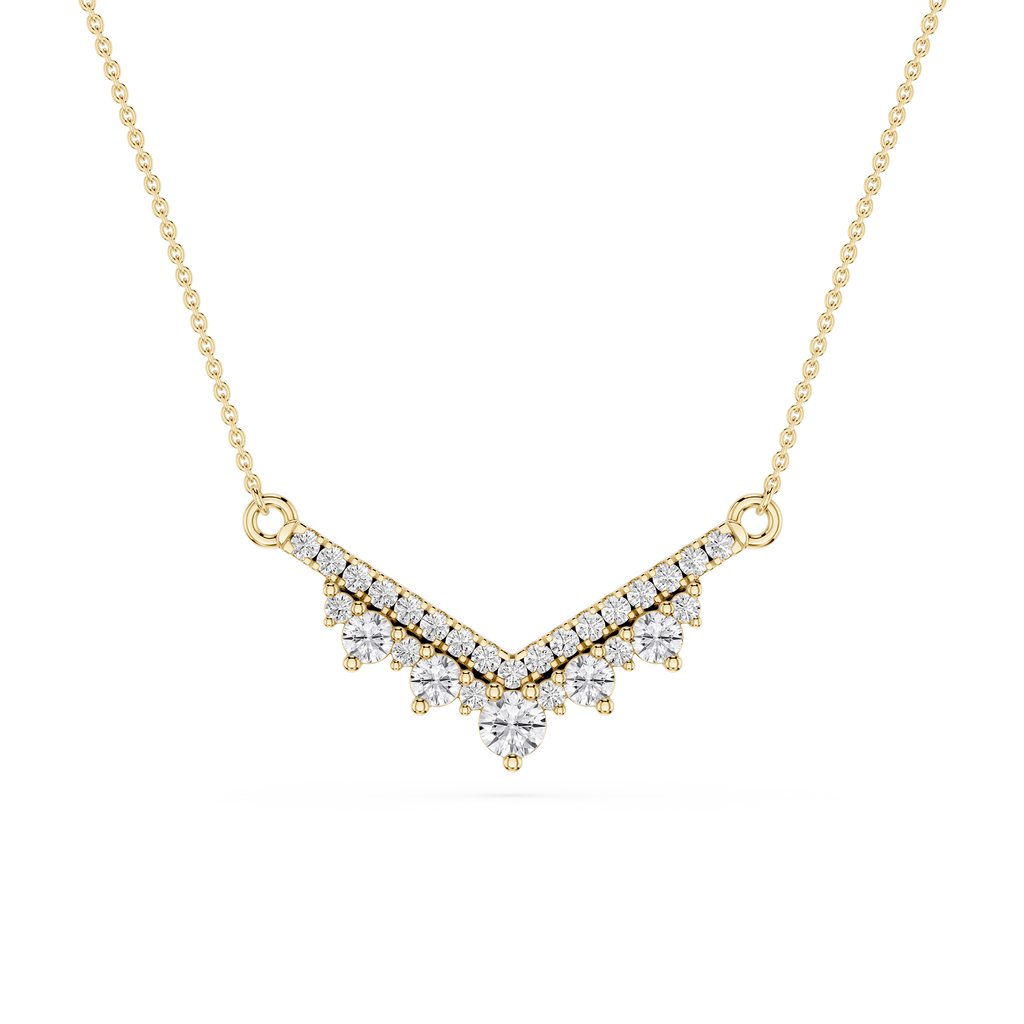 Gold necklace with a V-shaped diamond pendant on a white background