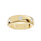 Gold ring with embedded diamonds on a white background