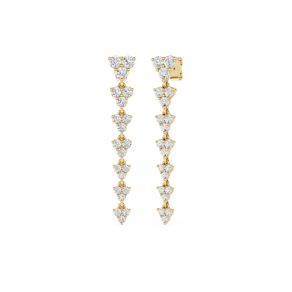Gold and diamond earrings on a white background
