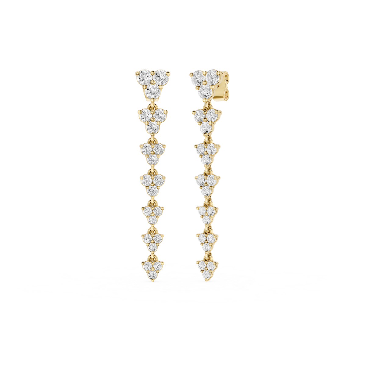 Gold and diamond earrings on a white background
