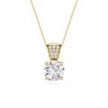 Gold necklace with a diamond pendant on a white background