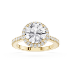 Gold ring with a large diamond and smaller diamonds on the band against a white background
