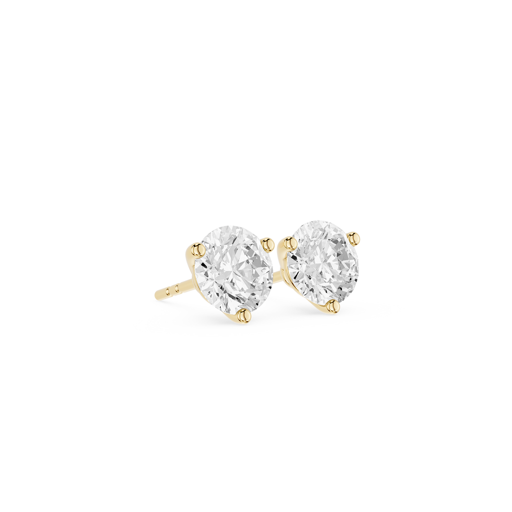 Pair of diamond stud earrings on a white background