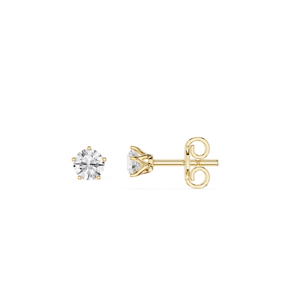 Gold stud earrings with clear gemstones on a white background
