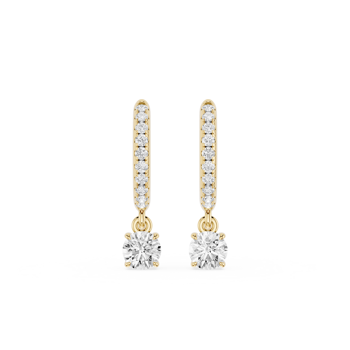 Gold hoop earrings with round gemstones on a white background