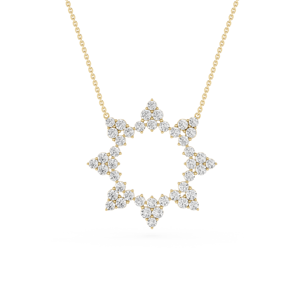 Diamond necklace with a star-shaped pendant on a gold chain against a white background