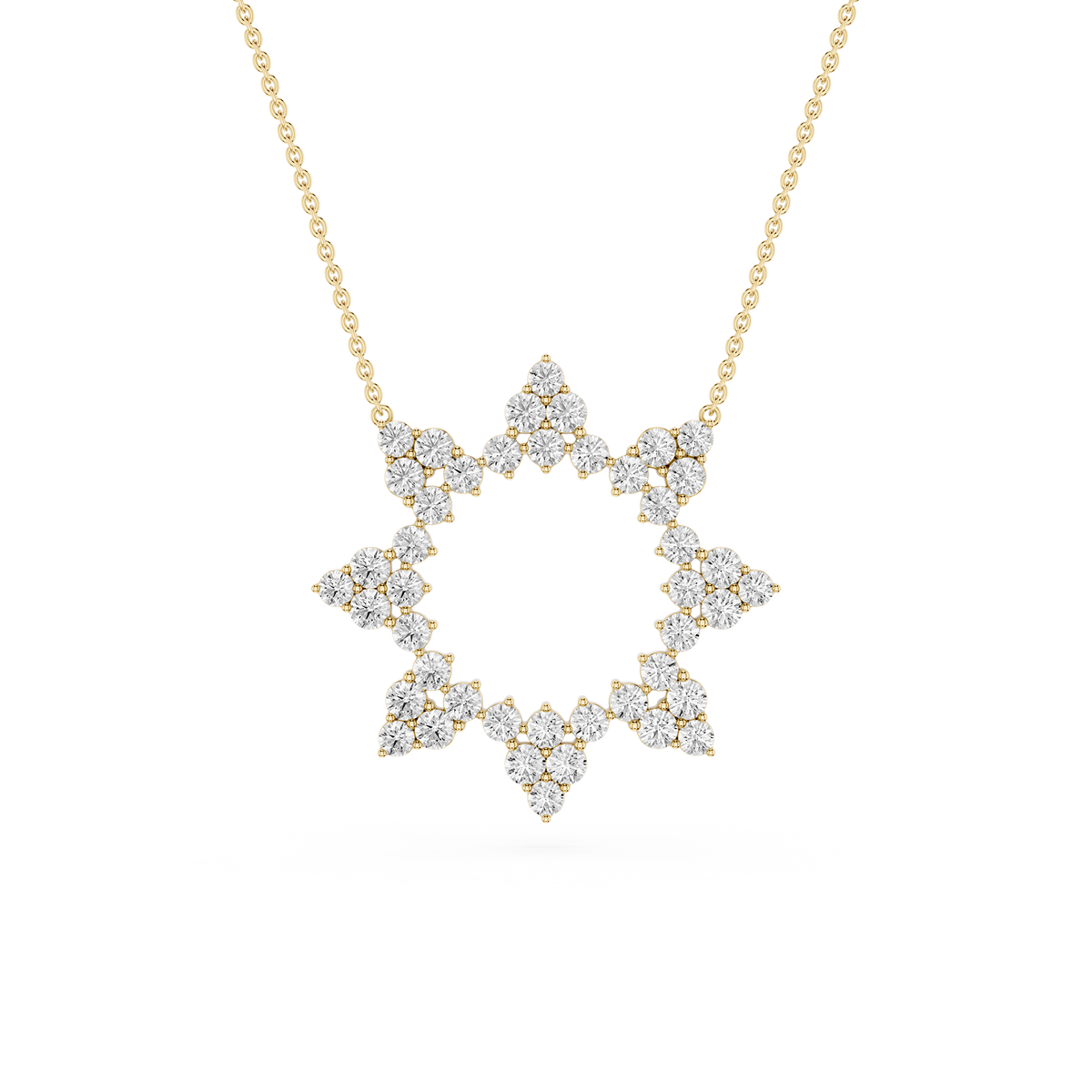 Diamond necklace with a star-shaped pendant on a gold chain against a white background