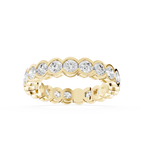 Yellow gold round cut lab grown diamond eternity wedding band featuring individual scalloped bezel settings