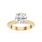 Gold ring with a large diamond on a white background