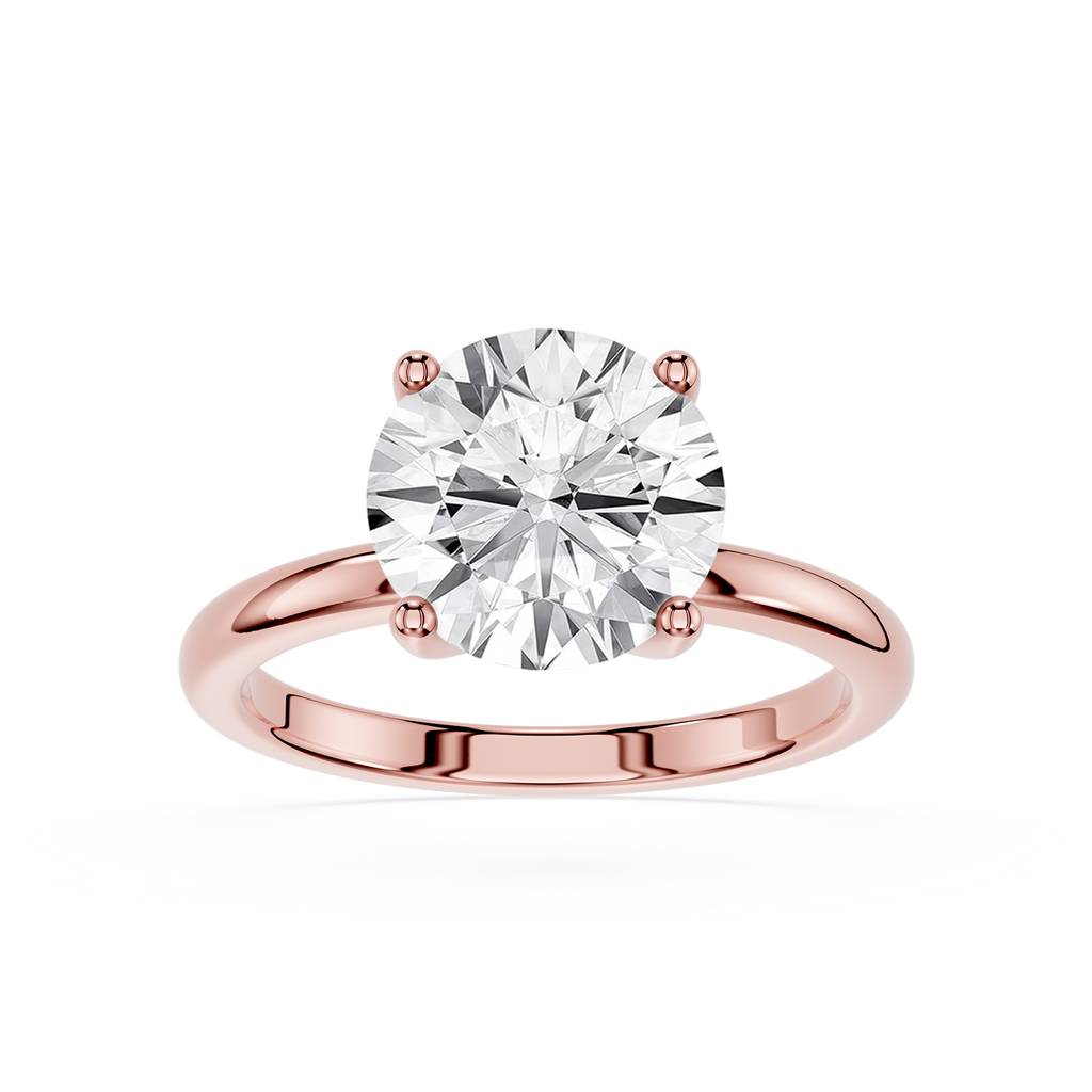 Rose gold ring with a large diamond on a white background
