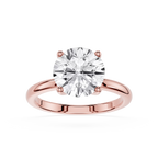 Rose gold ring with a large diamond on a white background